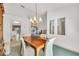 Formal dining room with chandelier, and a view of the outdoors at 13216 Parkhurst Ct, Riverview, FL 33569