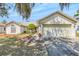 Inviting single-story home with an attached garage and meticulous landscaping in a suburban setting at 13216 Parkhurst Ct, Riverview, FL 33569