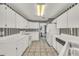 The kitchen features bright lighting, modern appliances, and tile floors at 13216 Parkhurst Ct, Riverview, FL 33569