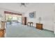 Living room showing sliding doors leading to the enclosed lanai at 13216 Parkhurst Ct, Riverview, FL 33569