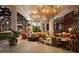 Spacious hotel lobby boasts stylish seating areas, a chandelier, and bar at 15000 Madeira Way # 505, Madeira Beach, FL 33708