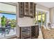 An entertainment bar area off the living room has a wine fridge and balcony access at 18 Franklin S Ct # D, St Petersburg, FL 33711