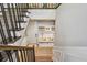 Welcoming entryway featuring a built-in bench, storage, and stylish staircase at 18 Franklin S Ct # D, St Petersburg, FL 33711