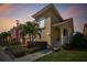 Beautiful exterior elevation showcasing a two-story home with well-maintained landscaping and a charming entrance at 18 Franklin S Ct # D, St Petersburg, FL 33711