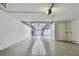 Spacious garage with epoxy floors, ample lighting, and storage space at 18 Franklin S Ct # D, St Petersburg, FL 33711