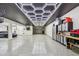 Expansive garage featuring epoxy floors, unique lighting, and storage cabinets at 18 Franklin S Ct # D, St Petersburg, FL 33711