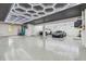 Spacious garage with epoxy flooring, custom lighting, and room for multiple vehicles at 18 Franklin S Ct # D, St Petersburg, FL 33711