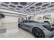 Modern garage featuring epoxy floors, unique lighting, and ample space for vehicles at 18 Franklin S Ct # D, St Petersburg, FL 33711
