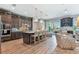 A bright and spacious eat-in kitchen with stainless appliances and light wood flooring is open to the living area at 18 Franklin S Ct # D, St Petersburg, FL 33711