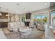 Open concept floor plan boasts a cozy living room and kitchen area with easy access to the outdoor living space at 18 Franklin S Ct # D, St Petersburg, FL 33711