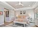 The main bedroom boasts a tray ceiling, stylish art work and furniture, plus lots of natural light at 18 Franklin S Ct # D, St Petersburg, FL 33711