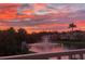 Scenic sunset view over the lake and fountain with palm trees and residences in the background at 18 Franklin S Ct # D, St Petersburg, FL 33711