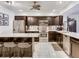 Modern kitchen featuring stainless steel appliances, dark wood cabinets, and white countertops at 521 Pinellas Bayway S # 204, St Petersburg, FL 33715