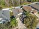Aerial view of the house showcasing its layout, landscaping, backyard and location within the neighborhood at 5913 Lawrin Ct, Wesley Chapel, FL 33544