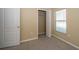Bedroom with carpet, closet and natural light from the window at 5913 Lawrin Ct, Wesley Chapel, FL 33544