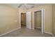 Spare bedroom with neutral carpet, ceiling fan, closet, and doorway at 5913 Lawrin Ct, Wesley Chapel, FL 33544