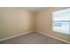 Empty bedroom featuring a window that provides natural light at 5913 Lawrin Ct, Wesley Chapel, FL 33544