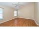 Large bedroom with laminate floors, ceiling fan, and one window offering natural light at 5913 Lawrin Ct, Wesley Chapel, FL 33544