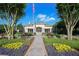 The Lexington Oaks Clubhouse is landscaped with flowers and bushes at 5913 Lawrin Ct, Wesley Chapel, FL 33544