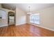 Bright dining room with laminate floors, chandelier, and a large window at 5913 Lawrin Ct, Wesley Chapel, FL 33544