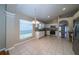 Bright kitchen with tile floors, white cabinets, and stainless steel appliances, plus eat-in dining area at 5913 Lawrin Ct, Wesley Chapel, FL 33544