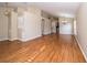 Open-concept living space with laminate floors, high ceilings, and stylish archways at 5913 Lawrin Ct, Wesley Chapel, FL 33544