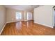 Inviting living room with laminate floors, neutral walls, and ample space for furniture at 5913 Lawrin Ct, Wesley Chapel, FL 33544