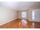 Cozy living room with laminate floors, natural light, and a view of the front yard at 5913 Lawrin Ct, Wesley Chapel, FL 33544