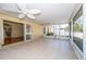 Spacious covered and screened in patio perfect for relaxing and entertaining, with sliding door access at 5913 Lawrin Ct, Wesley Chapel, FL 33544