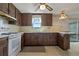 Well-lit kitchen with wooden cabinetry, appliances, and a breakfast nook, a great area for cooking and dining at 6636 Carnation Way, Port Richey, FL 34668