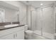 Bathroom featuring granite countertop vanity and glass shower at 9716 Mulberry Marsh Ln, Sun City Center, FL 33573