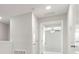 Well-lit second floor landing featuring multiple doorways and neutral decor at 9716 Mulberry Marsh Ln, Sun City Center, FL 33573