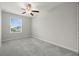 Bedroom with neutral walls, plush carpeting, ceiling fan, and a window with blinds at 9716 Mulberry Marsh Ln, Sun City Center, FL 33573