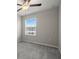 Bedroom with neutral walls, plush carpeting, ceiling fan, and a window with blinds at 9716 Mulberry Marsh Ln, Sun City Center, FL 33573