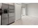 Features a stainless steel refrigerator with water dispenser and a view to the lanai at 9716 Mulberry Marsh Ln, Sun City Center, FL 33573
