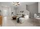 Bright living room featuring tile floors, a ceiling fan, and stairs to the second floor at 9716 Mulberry Marsh Ln, Sun City Center, FL 33573