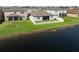 An aerial shot of the back of the house, displaying a beautiful waterfront backyard at 11717 Navajo Sandstone St, Riverview, FL 33579