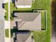 A high angle view of house with nice roof, green lawn, and view of lake at 11717 Navajo Sandstone St, Riverview, FL 33579