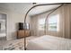 Light-filled bedroom offering views of the water, large dresser and television, with a neutral color scheme at 11717 Navajo Sandstone St, Riverview, FL 33579
