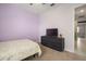 Bedroom features lilac colored walls and carpet flooring at 11717 Navajo Sandstone St, Riverview, FL 33579
