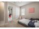 Bedroom features carpet flooring, window, and en suite bath at 11717 Navajo Sandstone St, Riverview, FL 33579