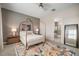 Bedroom showcasing a stylish bed, modern furnishings, and an ensuite bathroom with a soaking tub at 11717 Navajo Sandstone St, Riverview, FL 33579
