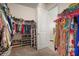 Spacious walk-in closet featuring ample storage for clothing, shoes, and accessories at 11717 Navajo Sandstone St, Riverview, FL 33579