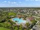Aerial view of a community pool and recreation area surrounded by lush landscaping and homes at 11717 Navajo Sandstone St, Riverview, FL 33579