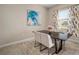 Cozy dining area with modern table, stylish chairs, and natural light from the large window at 11717 Navajo Sandstone St, Riverview, FL 33579