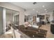 Bright dining area with sliding glass doors, views, stylish table, and an open flow to the kitchen at 11717 Navajo Sandstone St, Riverview, FL 33579