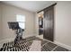 Exercise room features sliding barn door with a view to the kitchen at 11717 Navajo Sandstone St, Riverview, FL 33579