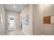 Inviting home foyer with tile flooring, neutral walls, and a charming front door with glass panels at 11717 Navajo Sandstone St, Riverview, FL 33579
