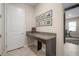 Office nook featuring a built-in desk and adjacent doorway to an exercise room at 11717 Navajo Sandstone St, Riverview, FL 33579
