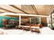 The covered patio boasts a bar and lounge area with mural for relaxation and enjoyment at 15000 Madeira Way # 609, Madeira Beach, FL 33708